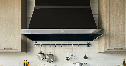 La Cornue custom wall-mount range hood above a marble backsplash